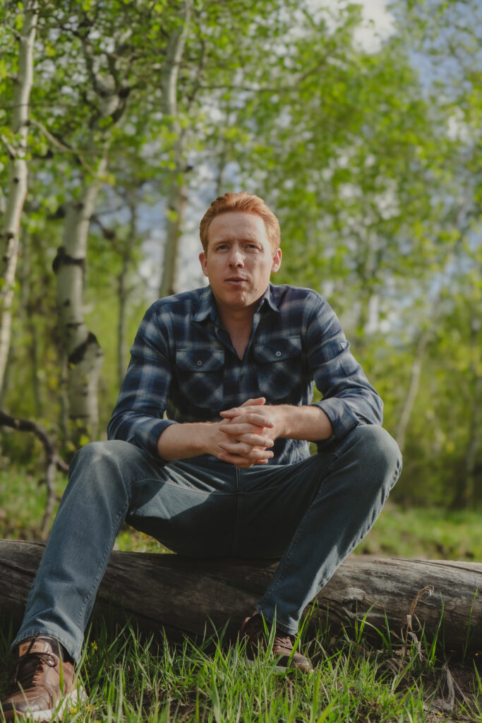 Jaden Jeffs sitting outdoors looking thoughtful